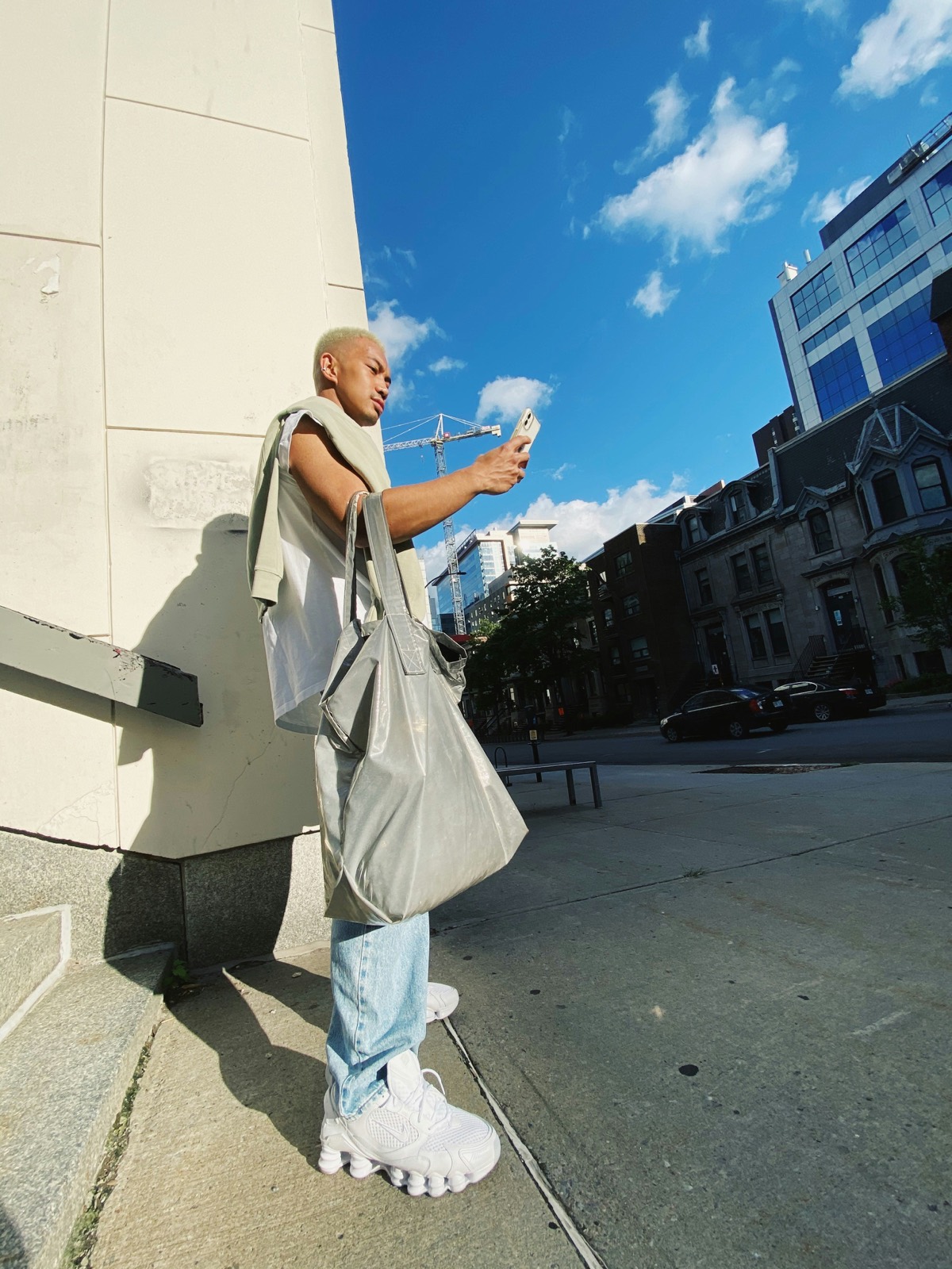 Person filming on a phone in the city